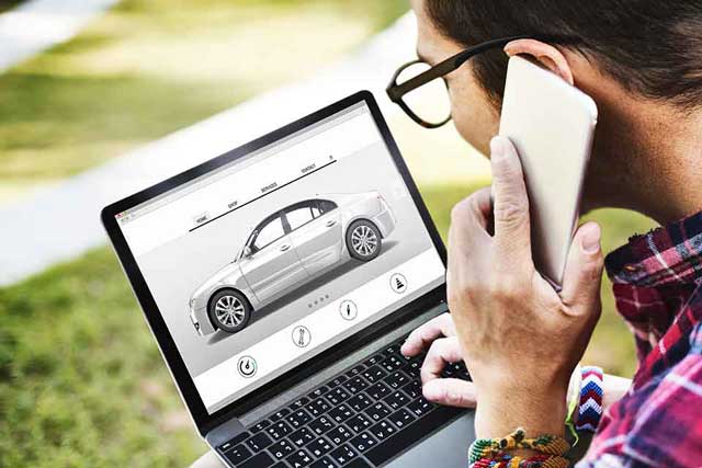 man shopping for car online