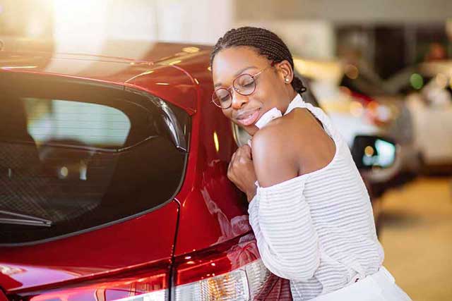 girl expressing love for a car