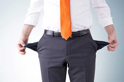 man holding out empty pockets